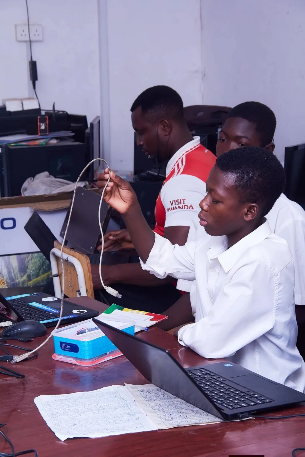 Students collaborating around a computer